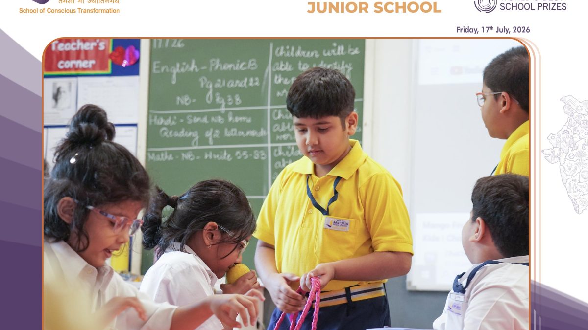 Students in yellow uniforms work together on fruit-themed crafts during Fruit Awareness Day in a classroom setting.