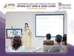 Speaker presenting to a classroom during an RPWD Act 2016 awareness session with a projected slide and engaged audience members present in a seminar setup.