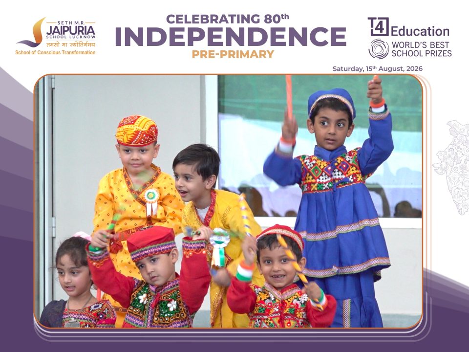Children in bright traditional outfits performing a dance at a school Independence Day event.