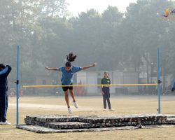 Participating in the high jump