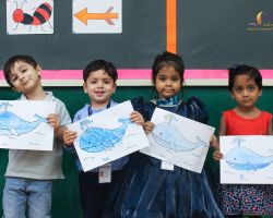 Posing with their whales on Blue Day