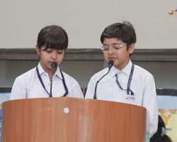 A duo of students addressing the audience