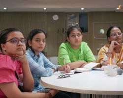 A group of student keenly absorbing the information being given in the session