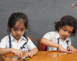 Little ones of UKG crafting a cute magnet for their mother