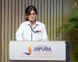 A student presenting the vote of thanks.