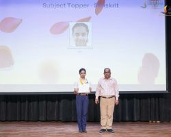 Subject Teacher congratulates the sub-topper in Sanskrit.